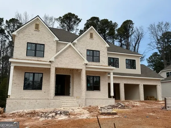 a front view of a house with yard
