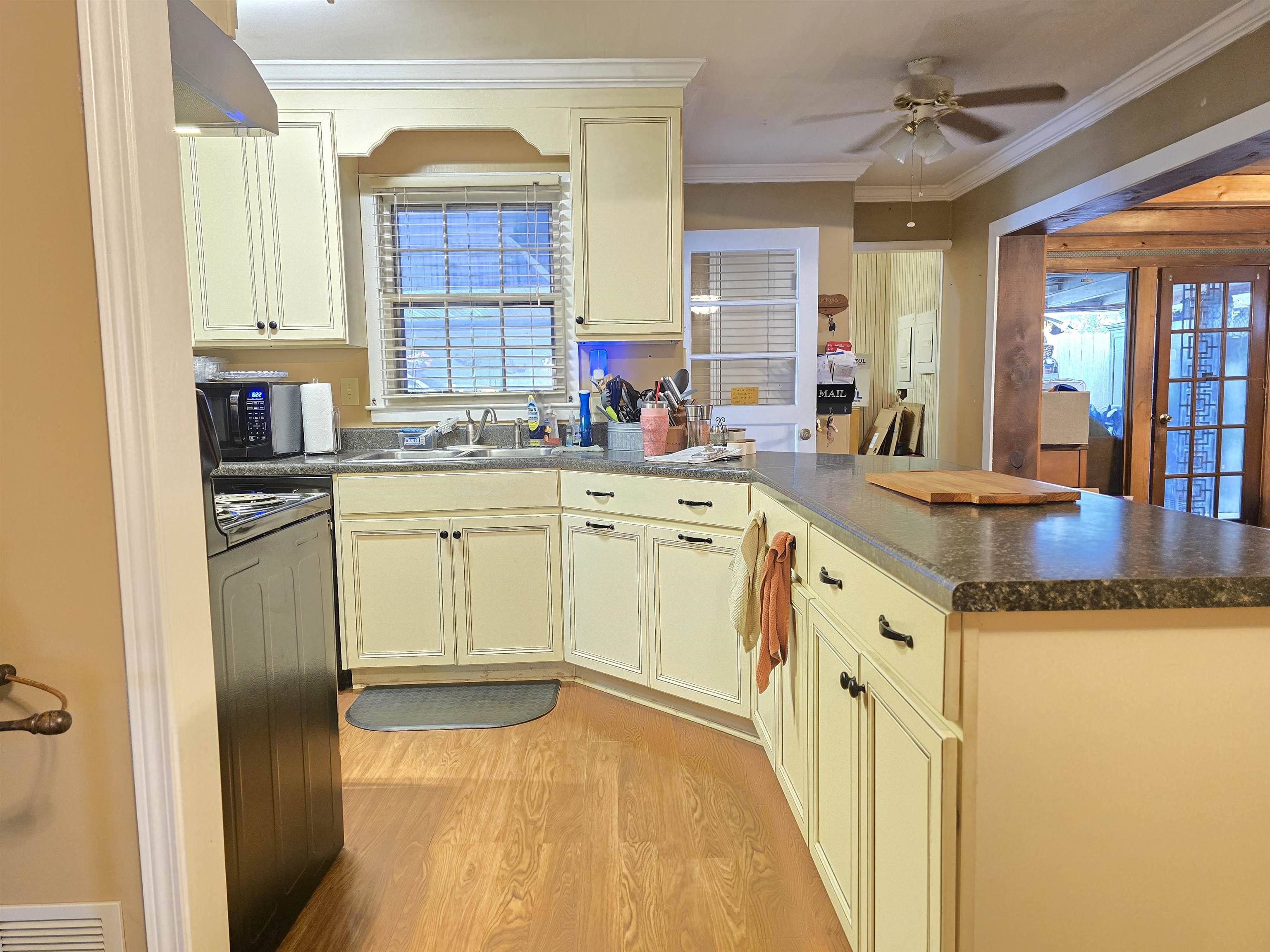 4885 Macon Road Memphis, TN 38122 - Photo 19 of 39 a kitchen with a sink cabinets and window