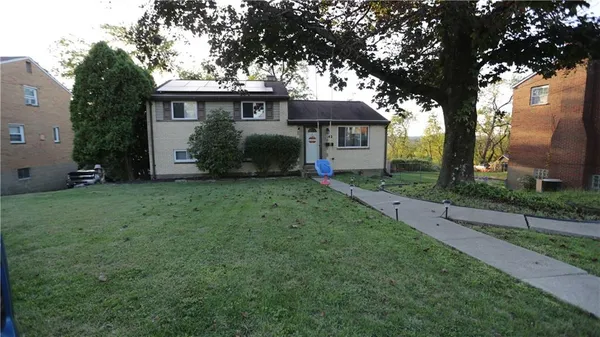 front view of a house with a yard