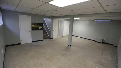 a white toilet sitting next to a bathroom sink