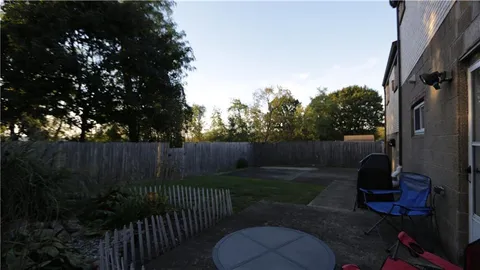 a view of a back yard of the house