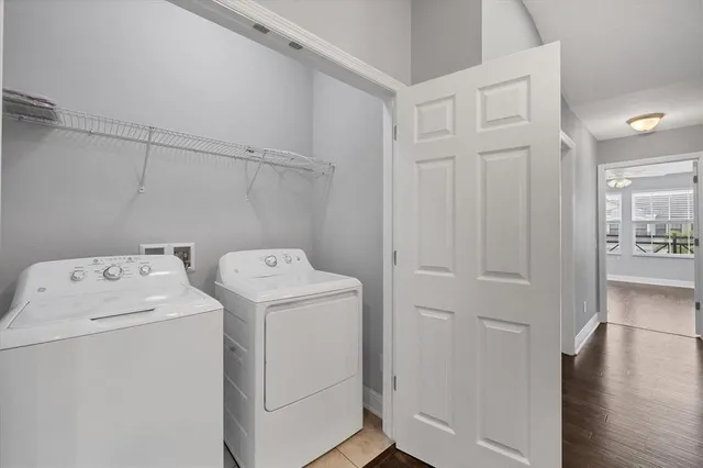 a view of storage and utility room with washer and dryer
