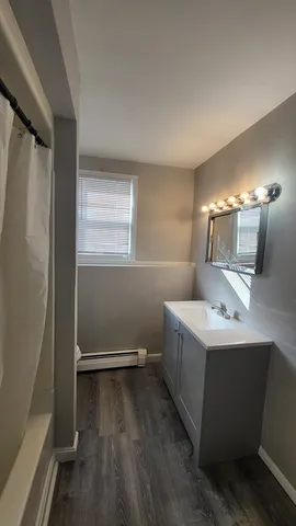 a bathroom with a sink and mirror