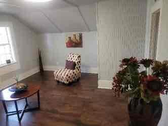 1103 East Moore Avenue, Unit 1 Terrell, TX 75160 - Photo 12 of 12 Bonus room featuring vaulted ceiling and dark wood-style floors