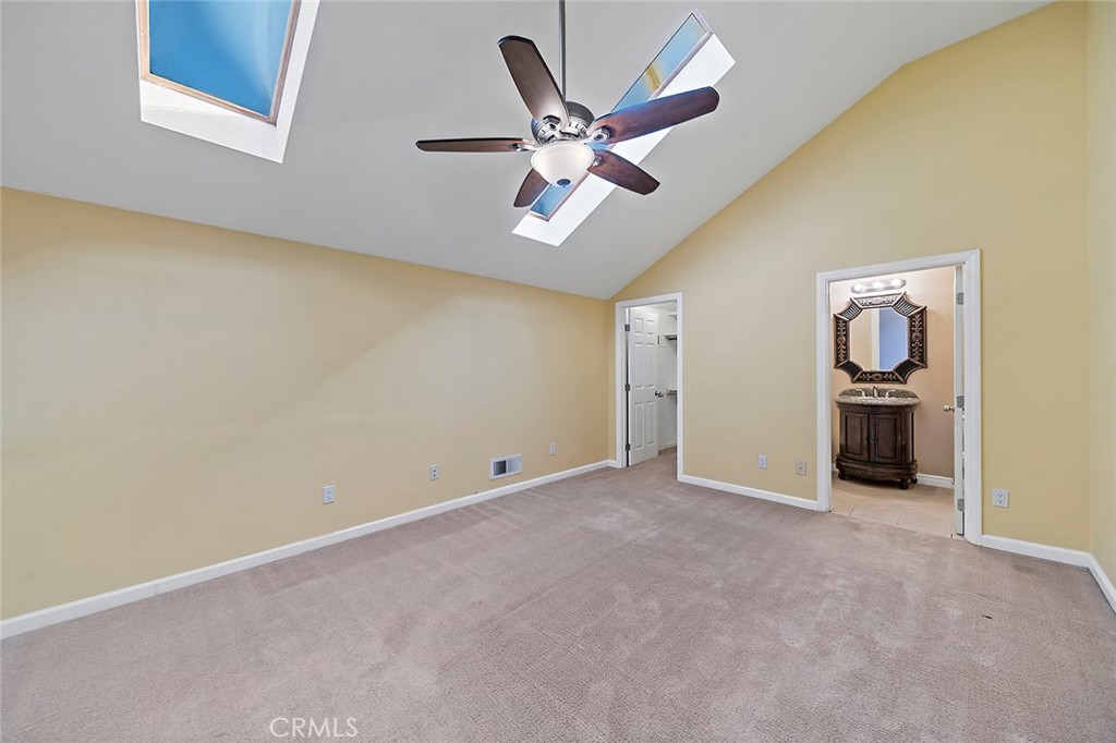 7720 Elmdale Way, Unit J Stanton, CA 90680 - Photo 13 of 18 an empty room with closet and fan