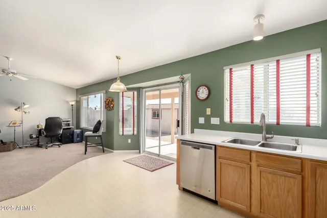 a bedroom with a bed and a television