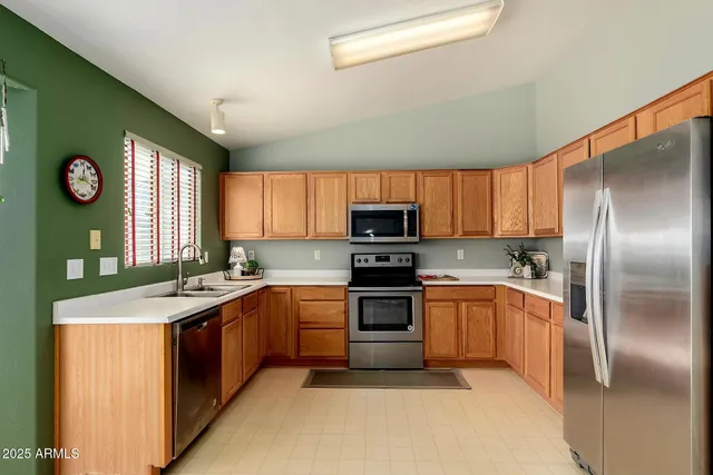 a bedroom with a bed mirror and window