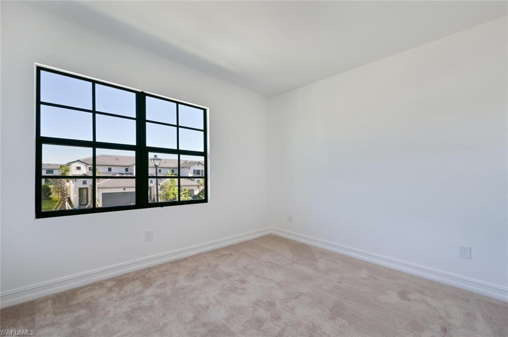 7611 Morgan Way Naples, FL 34119 - Photo 14 of 26 an empty room with a window