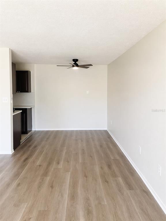 1695 Lee Road, Unit C206 Winter Park, FL 32789 - Photo 7 of 18 a view of empty room with wooden floor