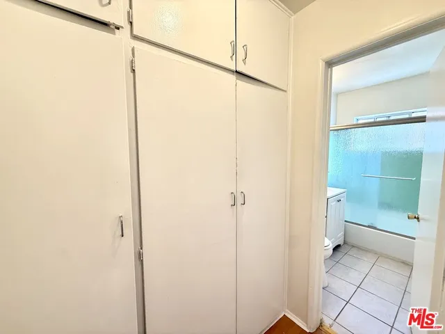 a bathroom with a glass shower door