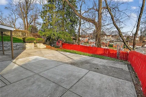 a view of backyard of red house