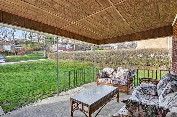 a backyard of a house with outdoor seating