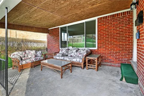 a view of a two chairs in the patio