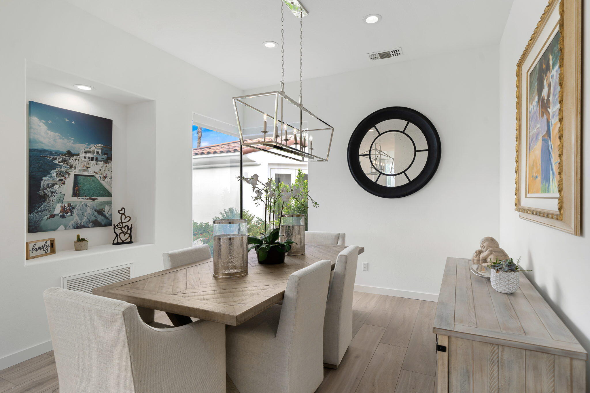 207 Loch Lomond Road Rancho Mirage, CA 92270 - Photo 15 of 50 a dining room with table and chairs