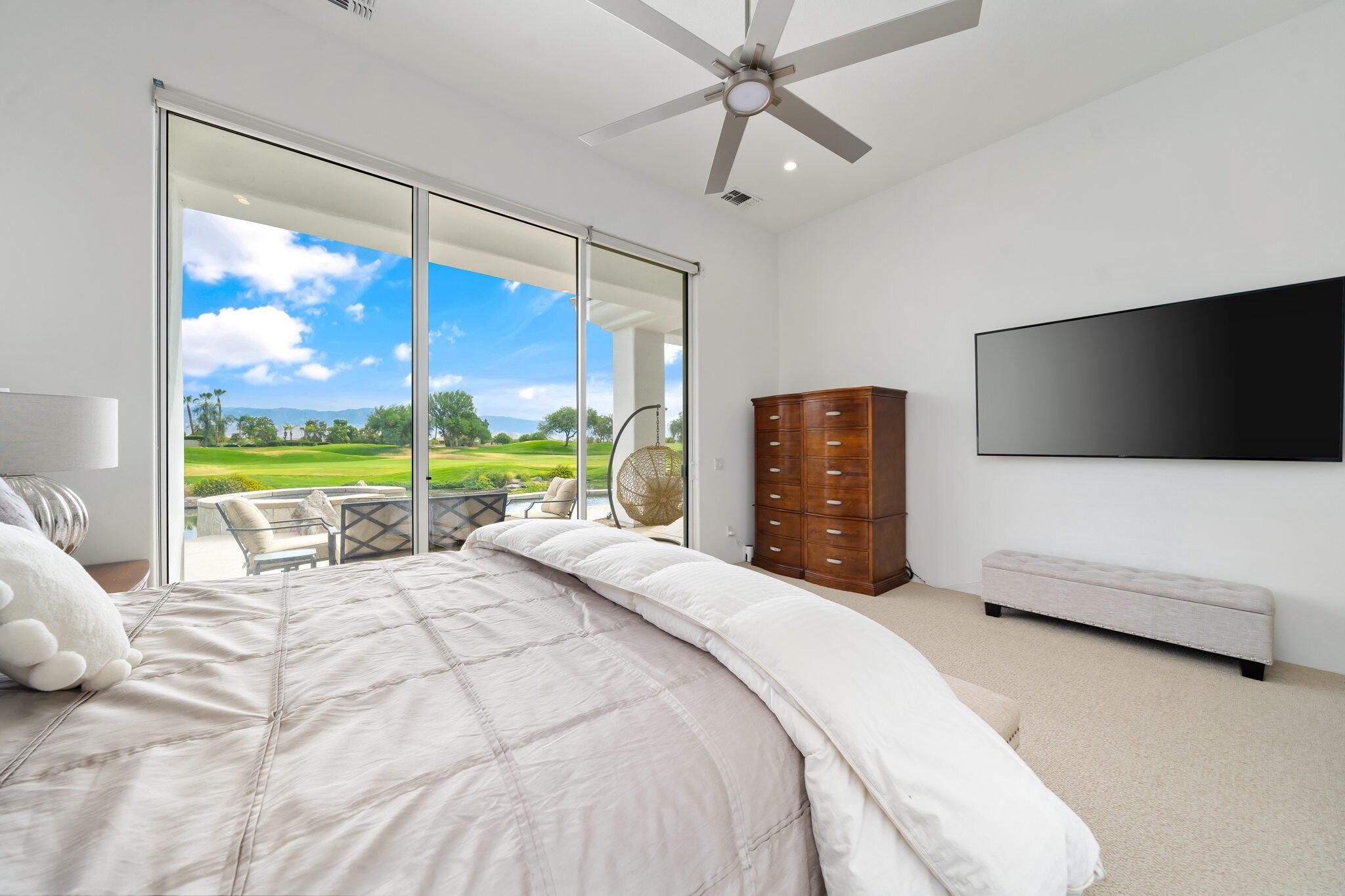 207 Loch Lomond Road Rancho Mirage, CA 92270 - Photo 25 of 50 a bedroom with a bed and a large window