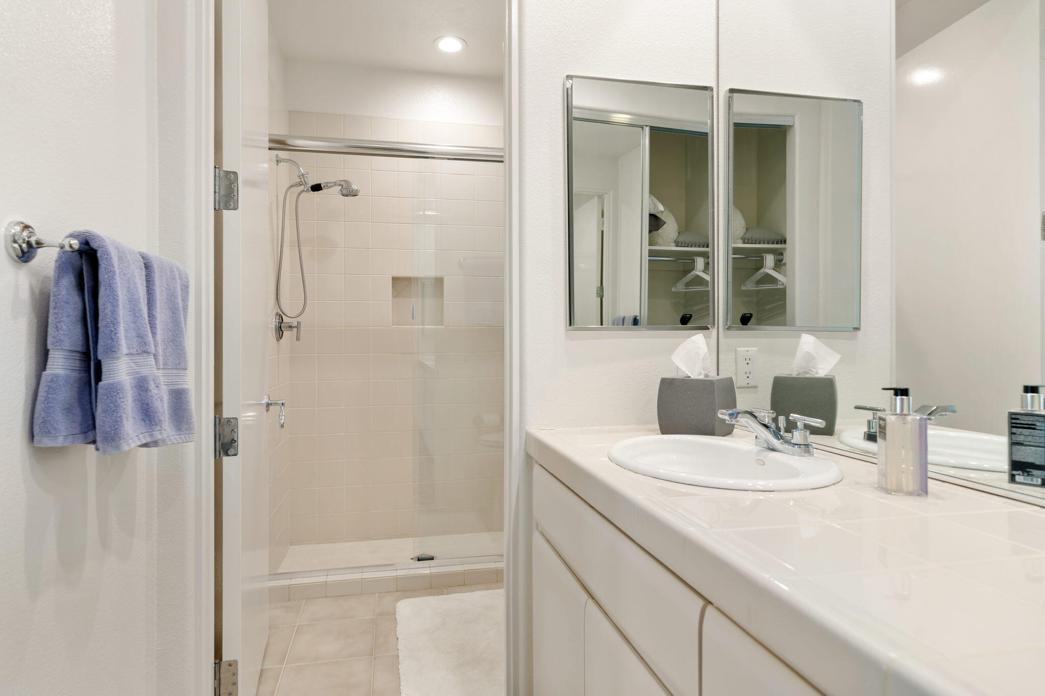 207 Loch Lomond Road Rancho Mirage, CA 92270 - Photo 35 of 50 a bathroom with a sink a mirror and shower