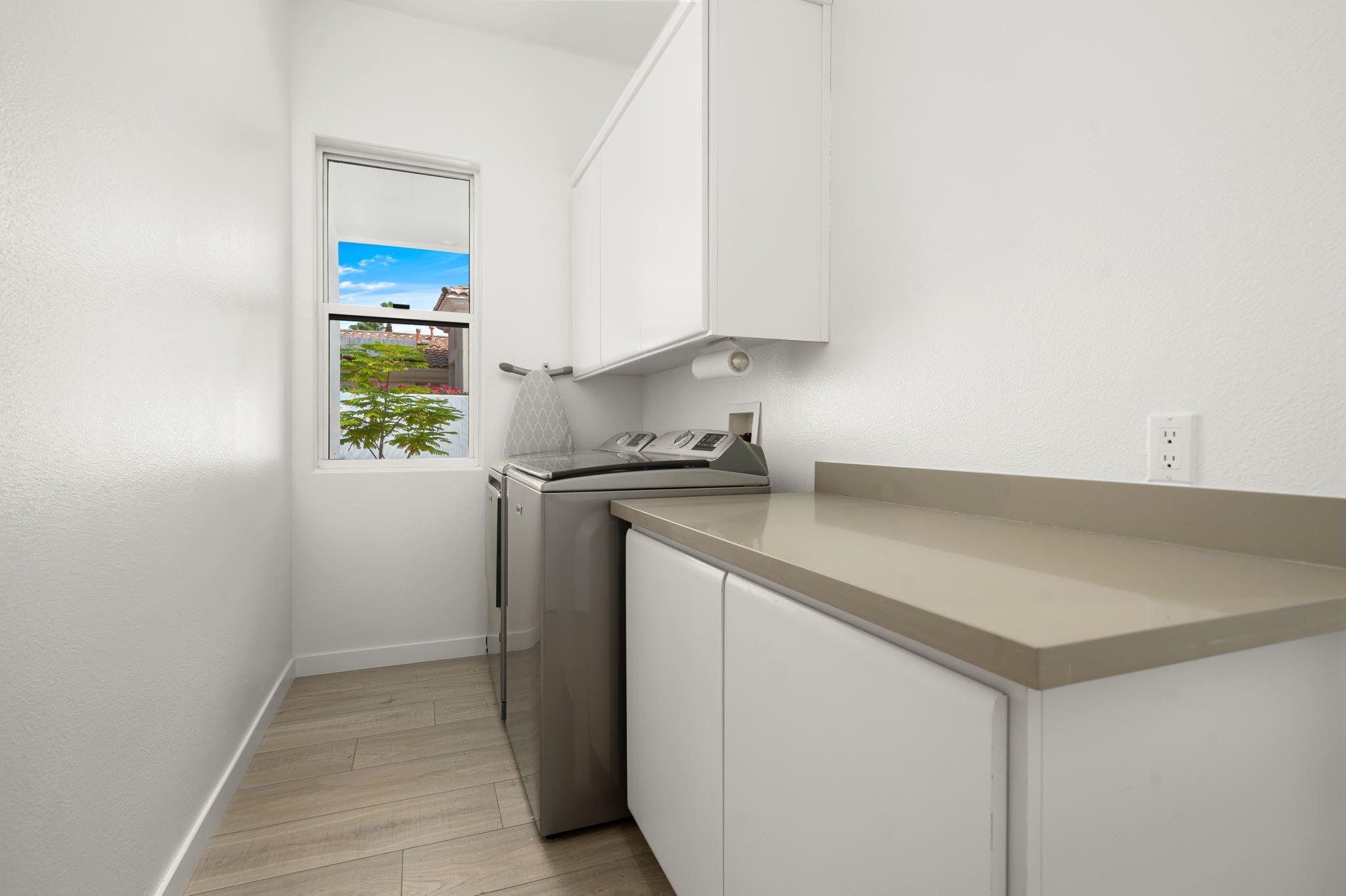 207 Loch Lomond Road Rancho Mirage, CA 92270 - Photo 36 of 50 a kitchen with a sink cabinets and a window