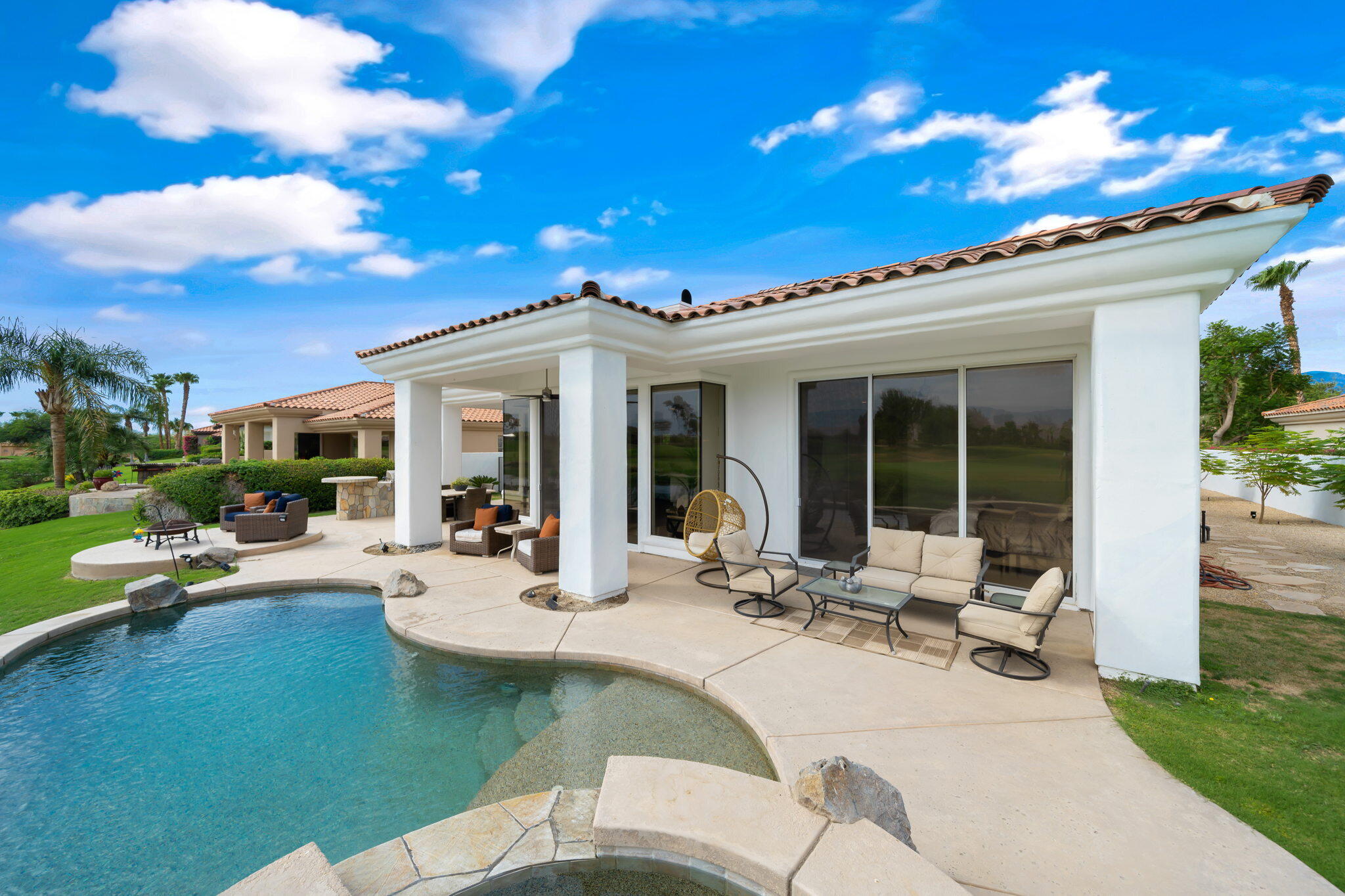 207 Loch Lomond Road Rancho Mirage, CA 92270 - Photo 39 of 50 a view of a house with swimming pool and sitting area