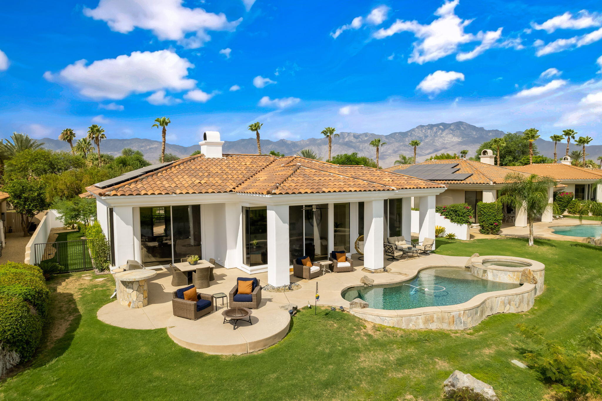 207 Loch Lomond Road Rancho Mirage, CA 92270 - Photo 4 of 50 a view of a house with backyard water fountain and sitting area