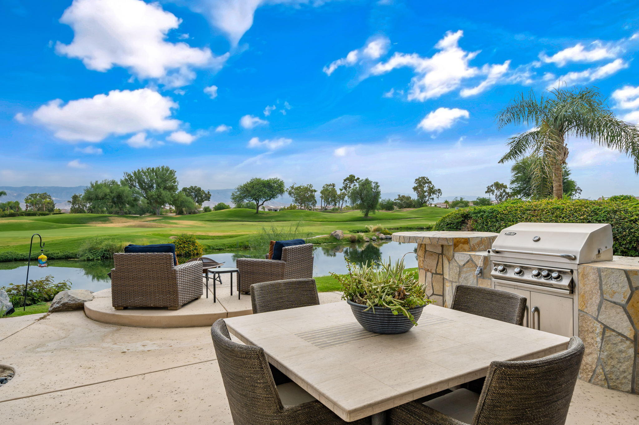 207 Loch Lomond Road Rancho Mirage, CA 92270 - Photo 41 of 50 a view of a patio with furniture and a yard