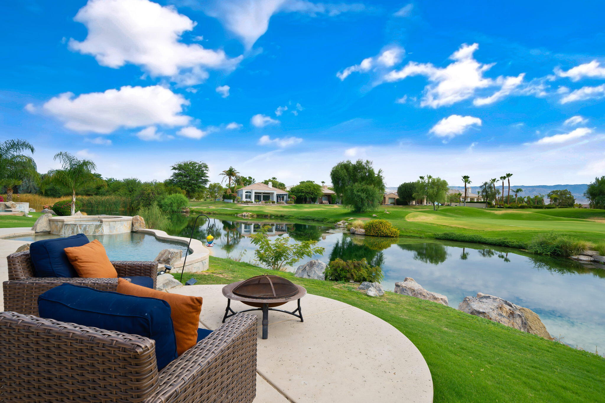 207 Loch Lomond Road Rancho Mirage, CA 92270 - Photo 44 of 50 a balcony with outdoor seating and lake