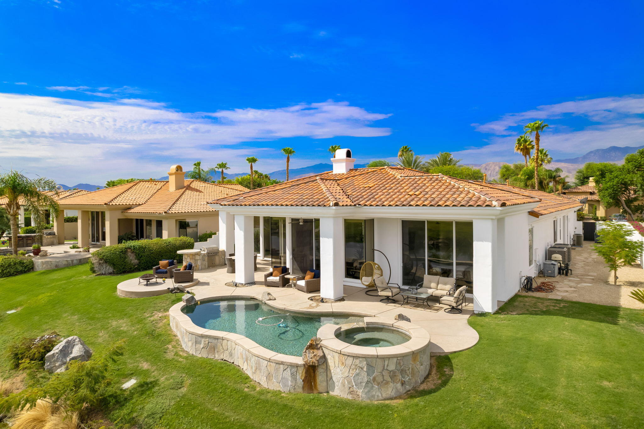 207 Loch Lomond Road Rancho Mirage, CA 92270 - Photo 45 of 50 a view of a house with swimming pool and porch