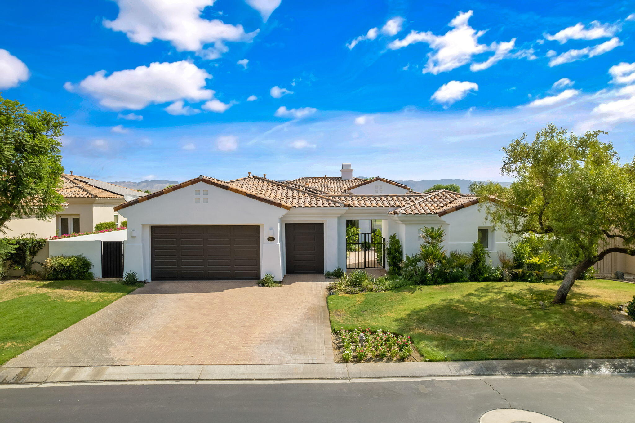 207 Loch Lomond Road Rancho Mirage, CA 92270 - Photo 6 of 50 a front view of a house with a yard