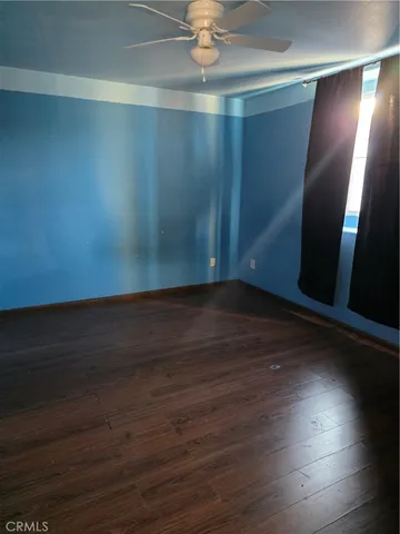 a view of room with hardwood floor