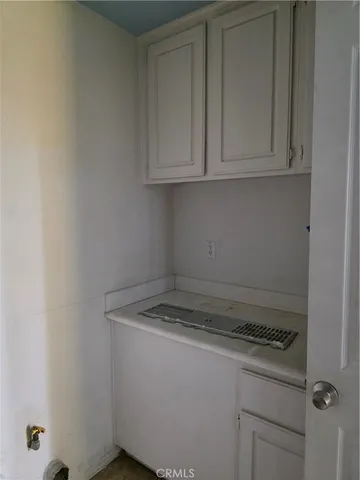 a bed room with a bed and a large window