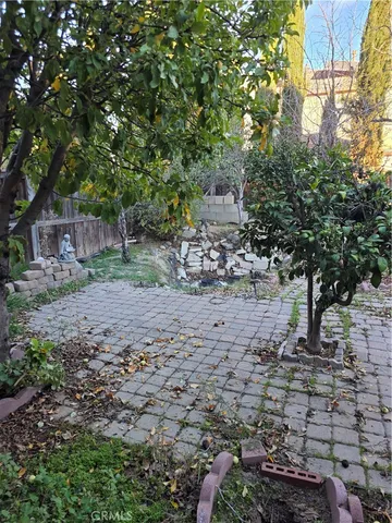 a view of a porch with a table under an umbrella