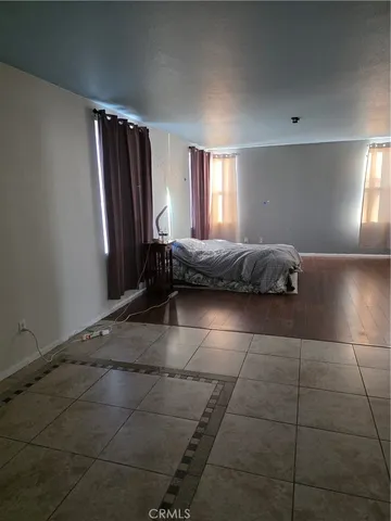 a living room with a couch and a window