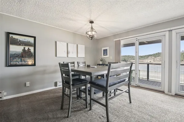 a kitchen with stainless steel appliances granite countertop a refrigerator and a stove