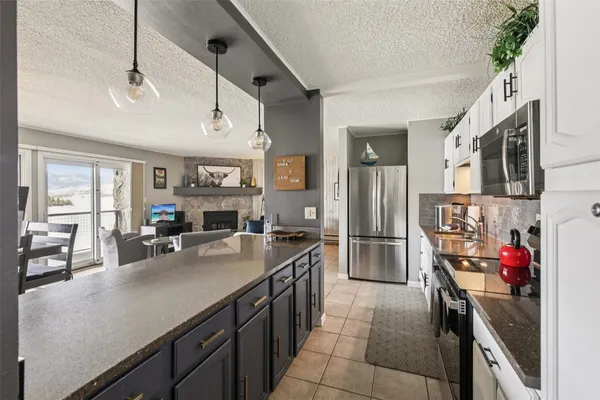 a bathroom with a granite countertop sink mirror and toilet