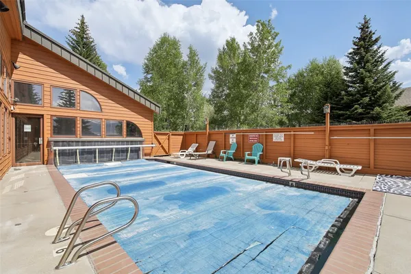 a view of a brick house with large windows