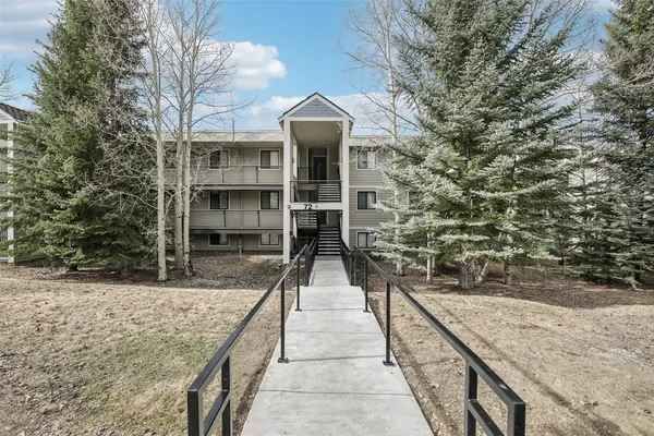a view of a hallway with washer and dryer