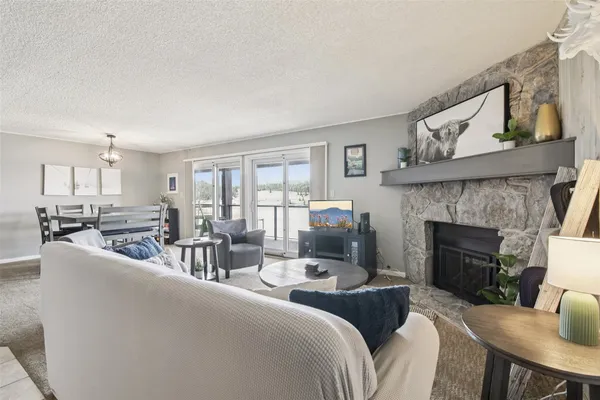 a living room with furniture and a clock