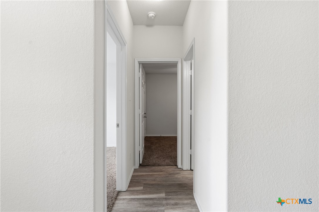 212 Bainbridge Road Temple, TX 76502 - Photo 15 of 35 a view of a hallway with wooden floor