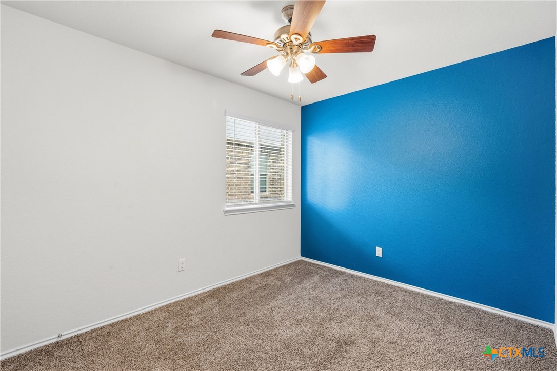 212 Bainbridge Road Temple, TX 76502 - Photo 23 of 35 an empty room with windows and fan