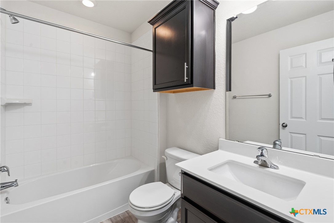 212 Bainbridge Road Temple, TX 76502 - Photo 25 of 35 a bathroom with a sink toilet and shower