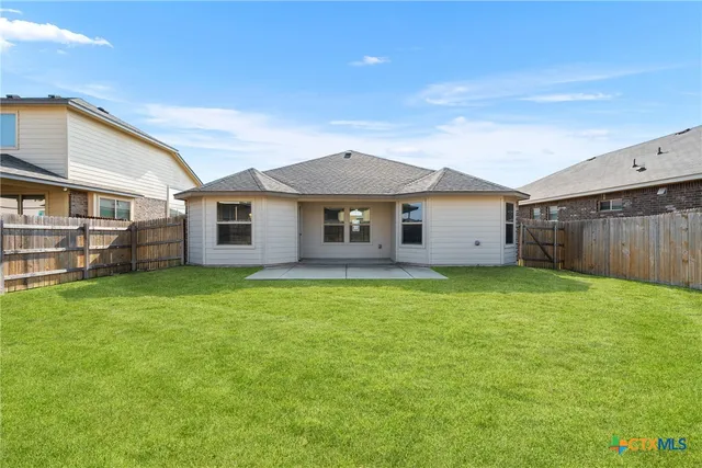a outdoor view of a house with a backyard