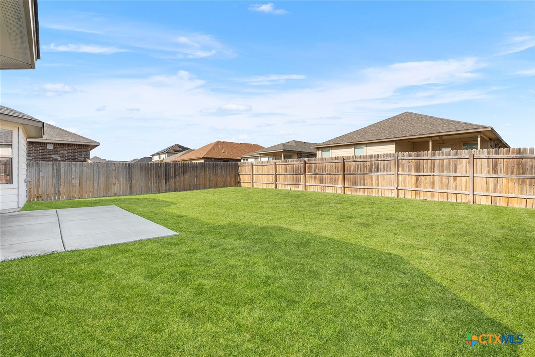 212 Bainbridge Road Temple, TX 76502 - Photo 31 of 35 a view of a yard in front of a house with a garden