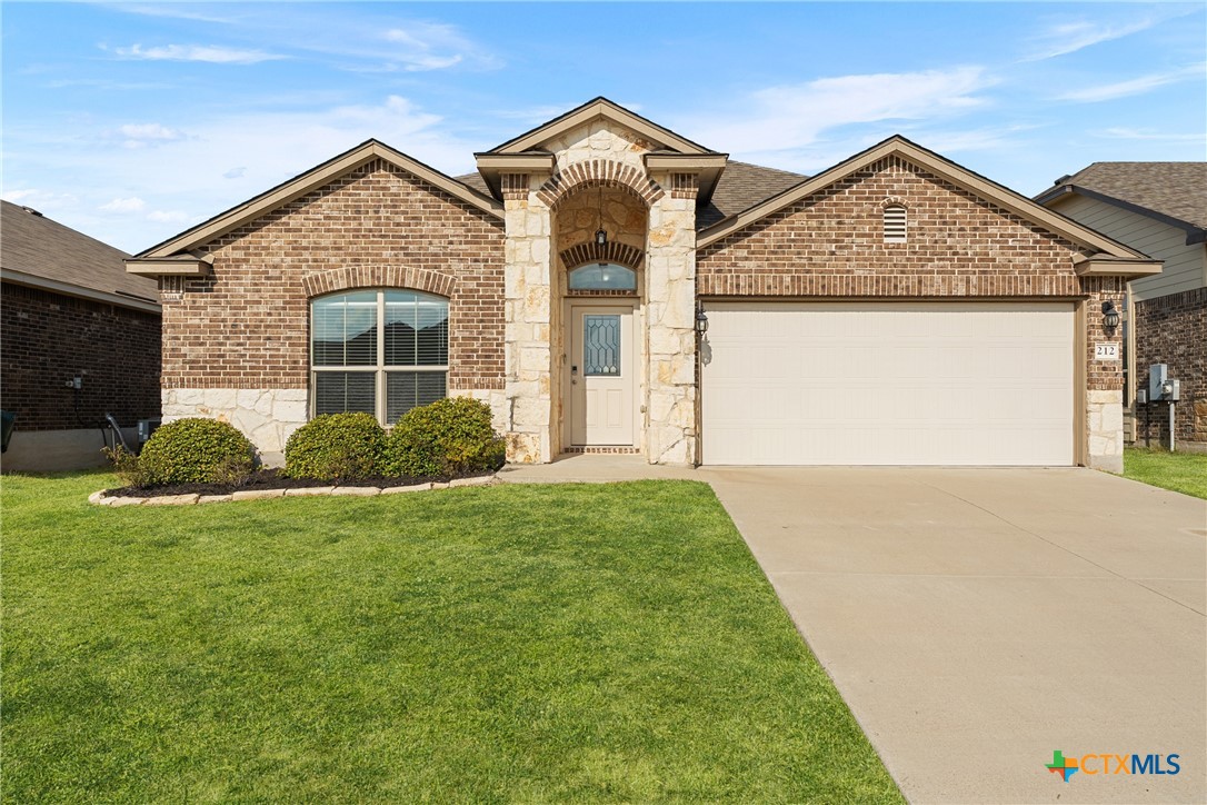 212 Bainbridge Road Temple, TX 76502 - Photo 5 of 35 a front view of a house with garden