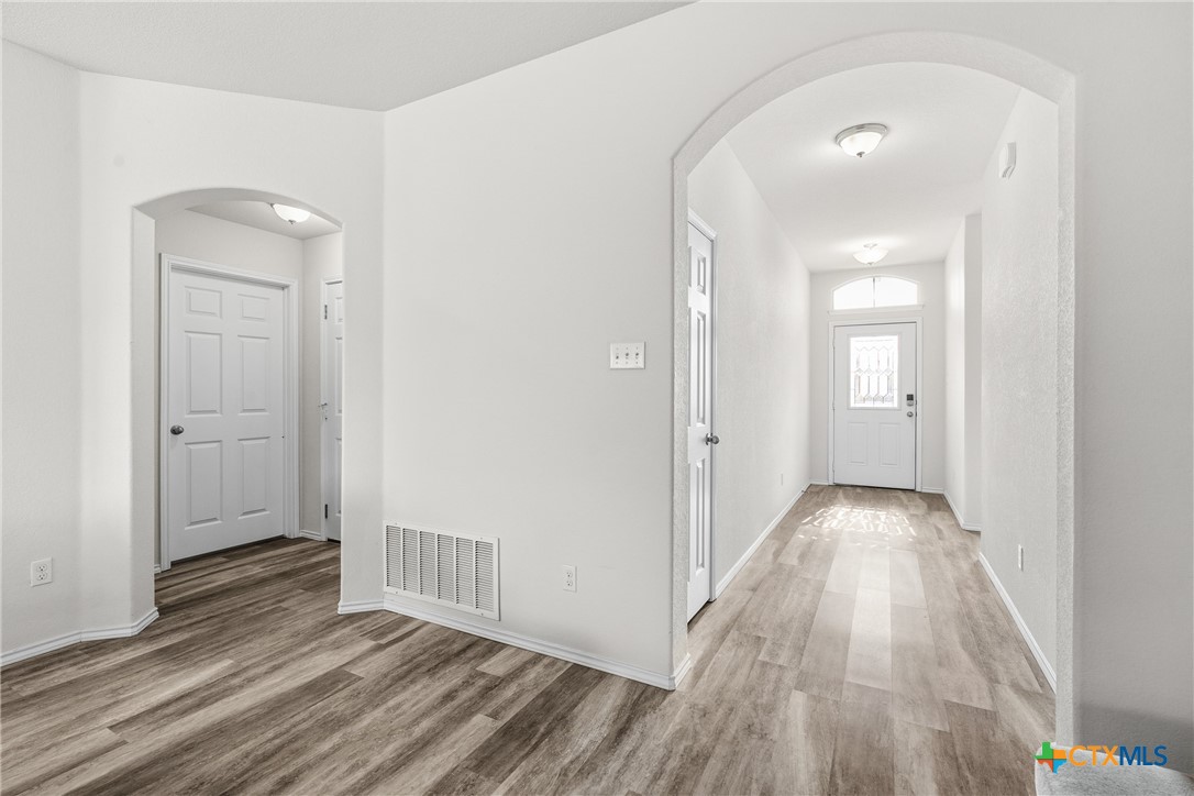 212 Bainbridge Road Temple, TX 76502 - Photo 7 of 35 a view of hallway with wooden floor