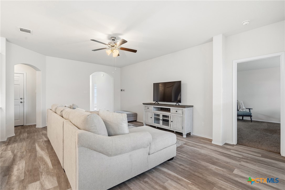 212 Bainbridge Road Temple, TX 76502 - Photo 9 of 35 a living room with furniture and a flat screen tv