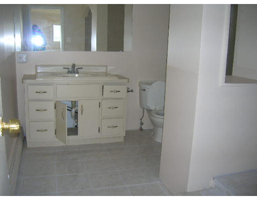 295 Shirley Street, Unit 2 Winthrop, MA 02152 - Photo 7 of 12 a bathroom with a sink and a mirror