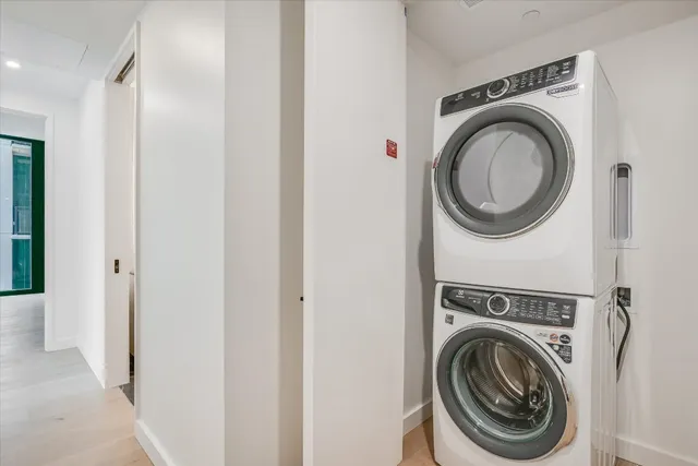 a view of a hallway with washer and dryer