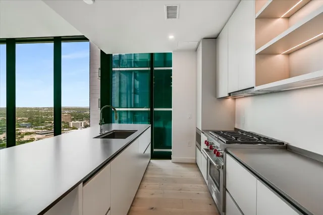 a kitchen with counter top space and stainless steel appliances
