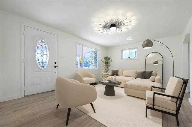 a living room with furniture and a large window