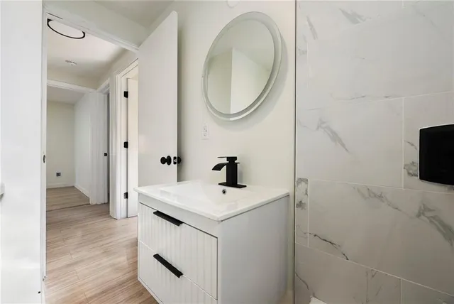 a bathroom with a sink and a mirror