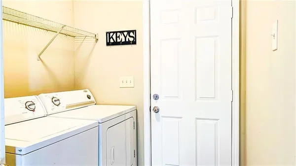 a utility room with dryer and washer